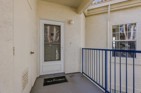 a view of a door and a window