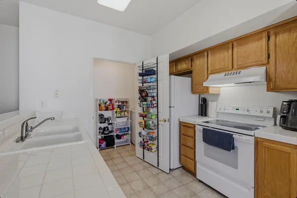 a kitchen with fridge and rack