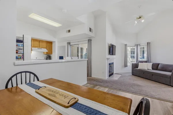 a living room with furniture and flat screen tv