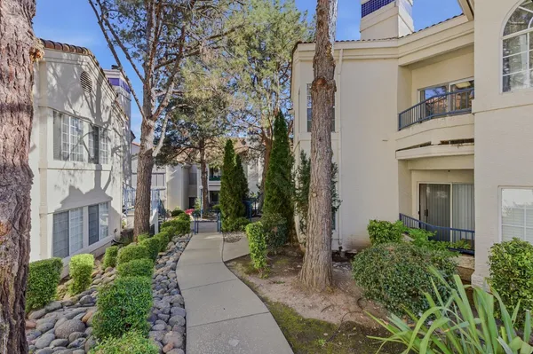 a view of a pathway with a house