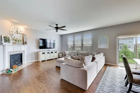 a living room with furniture fireplace and a flat screen tv