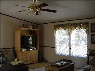 6238 Old River Road Baker, FL 32531 - Photo 3 of 8 a living room with furniture and a window