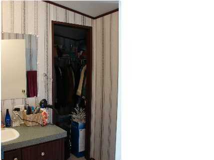 6238 Old River Road Baker, FL 32531 - Photo 8 of 8 a bathroom with a sink and a mirror