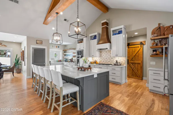 a utility room with sink dryer and washer