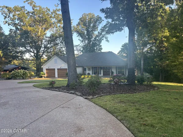a view of a house with potted plants