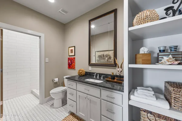 a living room with furniture and a rug