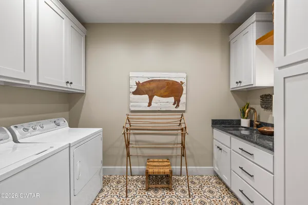 a living room with furniture and a rug