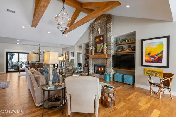 a kitchen with stainless steel appliances granite countertop a sink a oven and a refrigerator