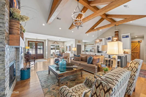 a kitchen with stainless steel appliances kitchen island granite countertop a sink and cabinets