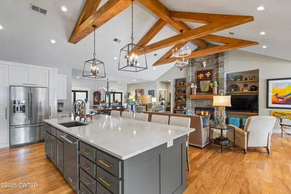 a large kitchen with stainless steel appliances granite countertop lots of counter top space