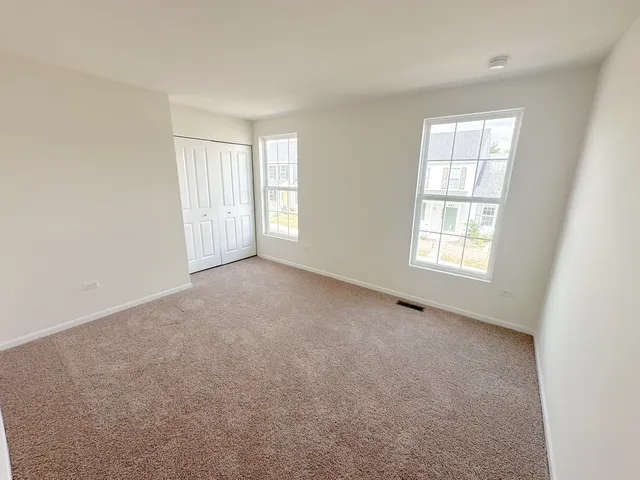 an empty room with windows