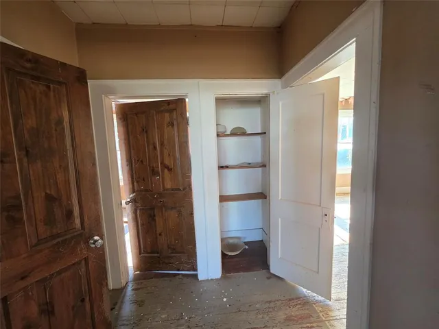 a view of a hallway with a closet