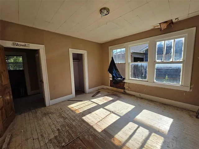 a bedroom with windows