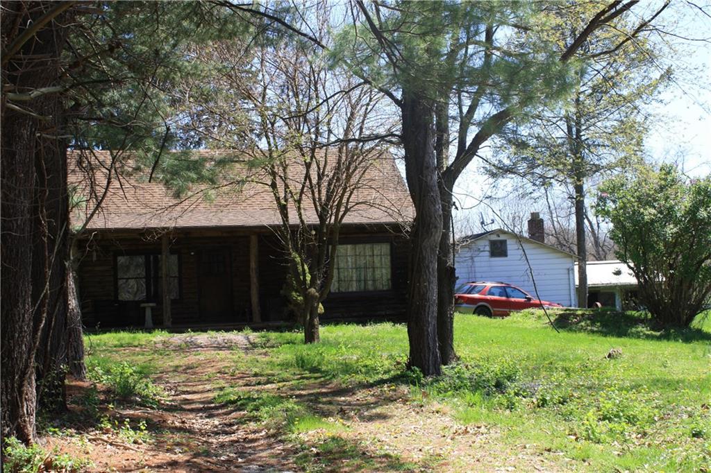 3600 Centerview Road Gibsonia, PA 15044 - Photo 24 of 25 Driveway view of the cabin, a small original "white house" the seller says may be a "tear-down", and the white stall barn to the right.