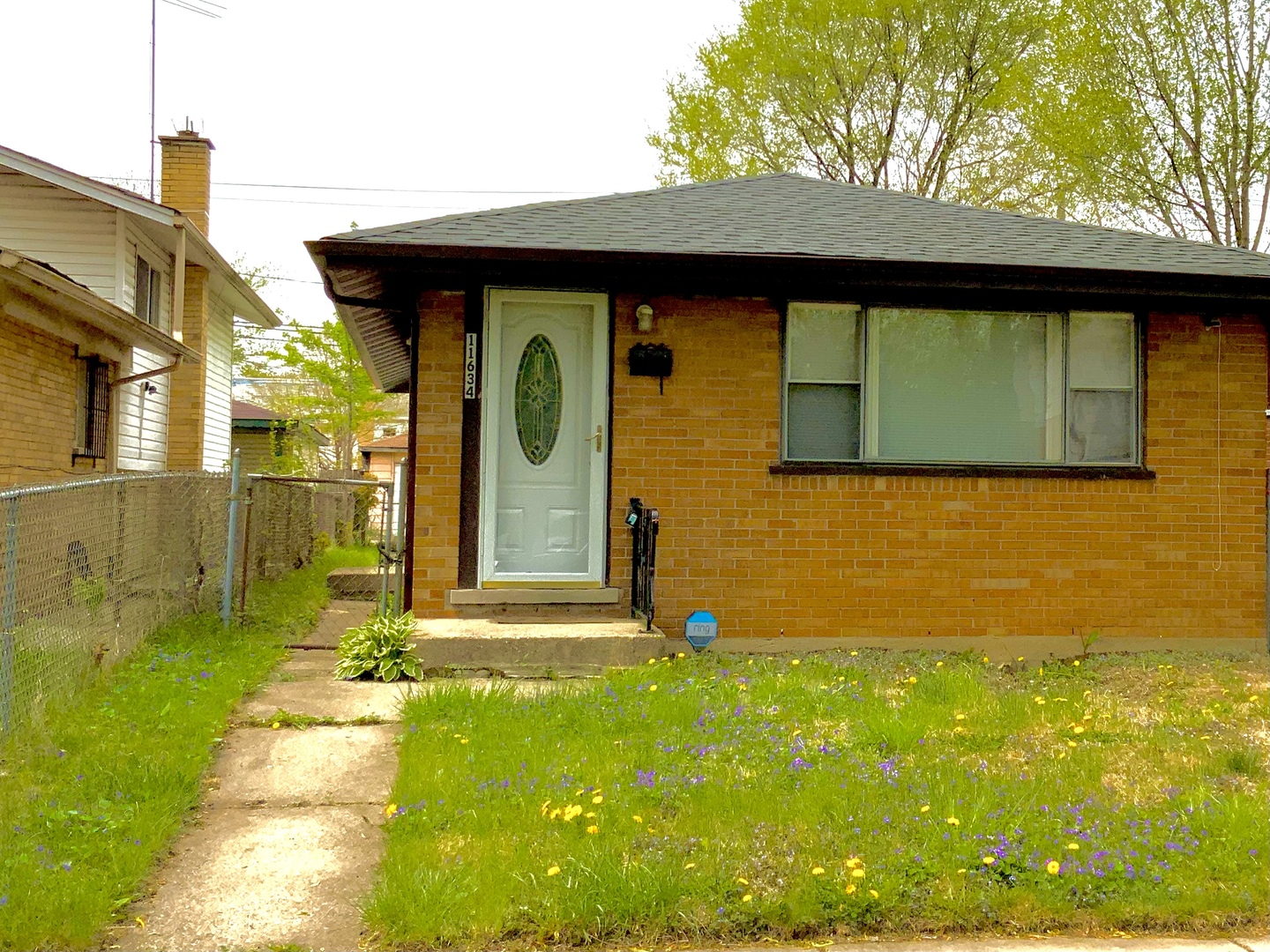 11634 South May Street Chicago, IL 60643 - Photo 1 of 9 a front view of a house with a yard
