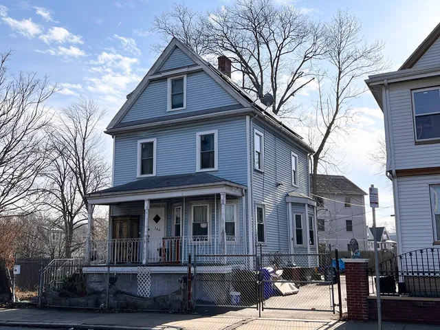 a front view of a house with yard