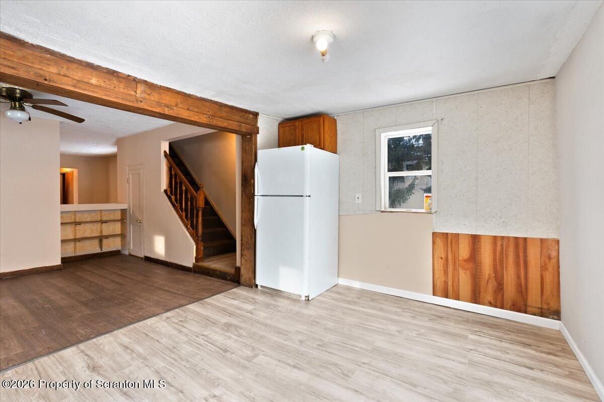 719 South Webster Avenue Scranton, PA 18505 - Photo 8 of 17 a view of an empty room with wooden floor and a window