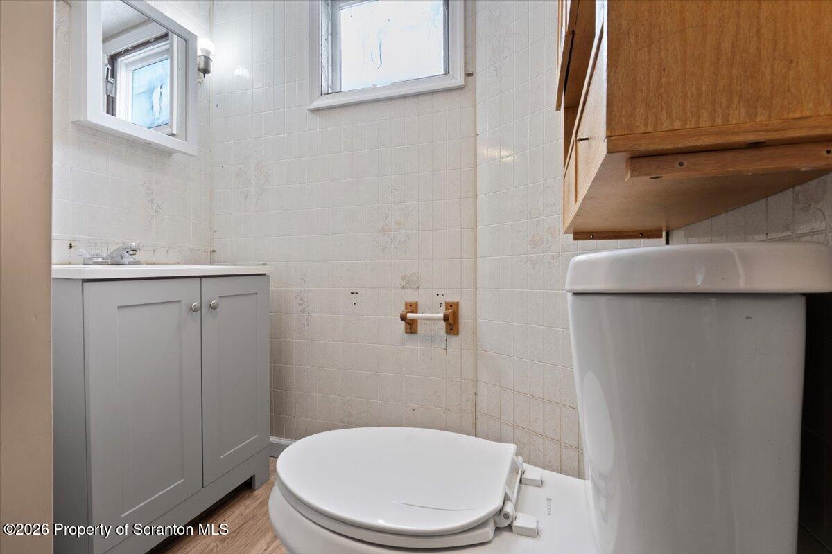 719 South Webster Avenue Scranton, PA 18505 - Photo 9 of 17 a white toilet sitting next to a bathroom sink
