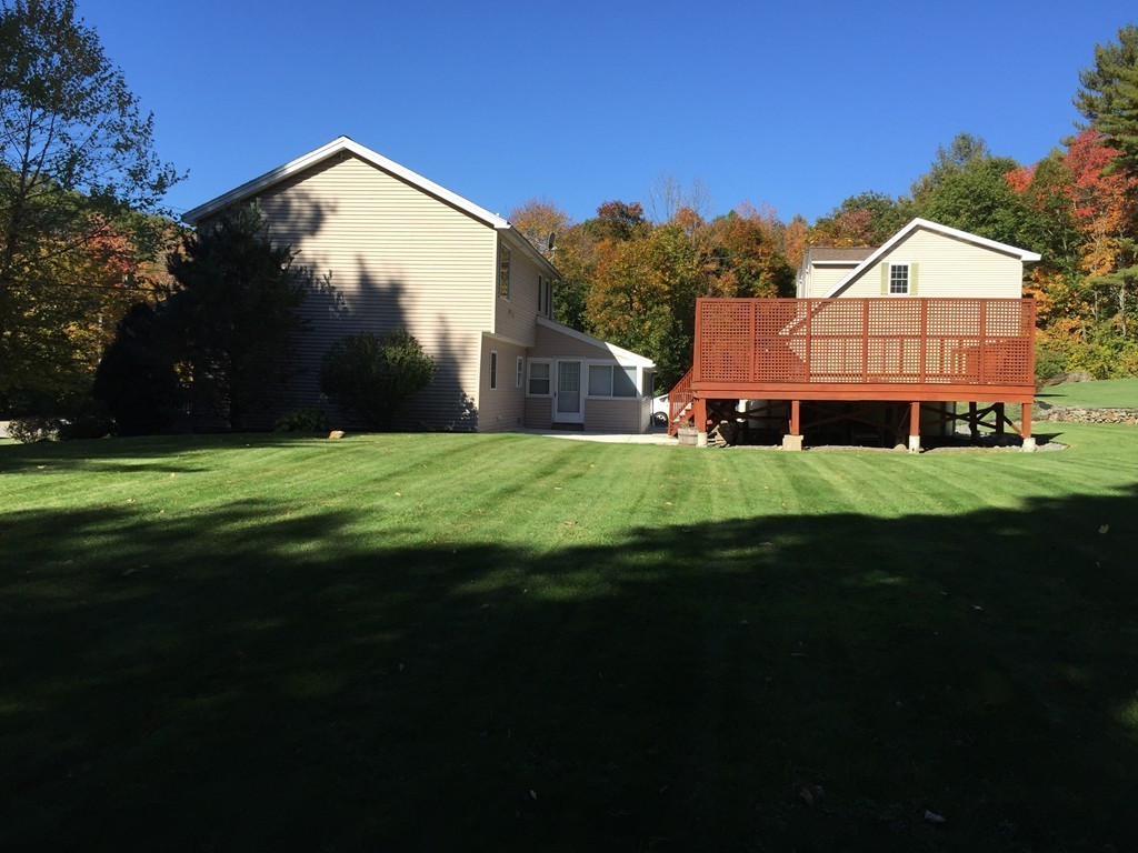 159 Fitchburg Road Ashburnham, MA 01430 - Photo 2 of 13 a view of an house with backyard and garden