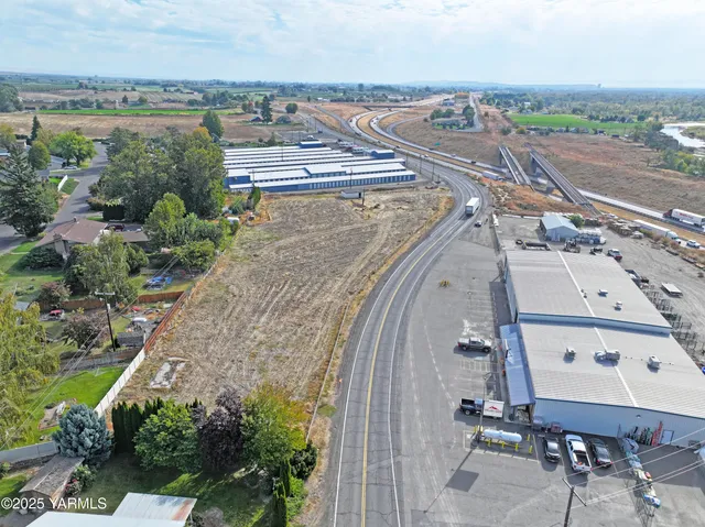an aerial view of a house with outdoor space