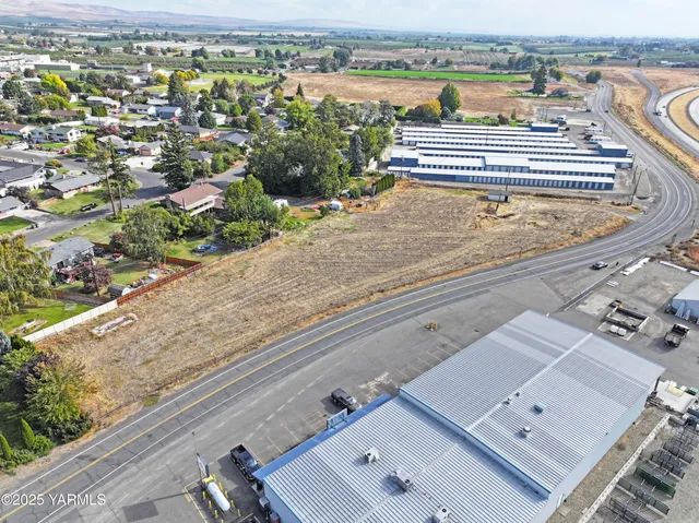 an aerial view of a house with a lake view