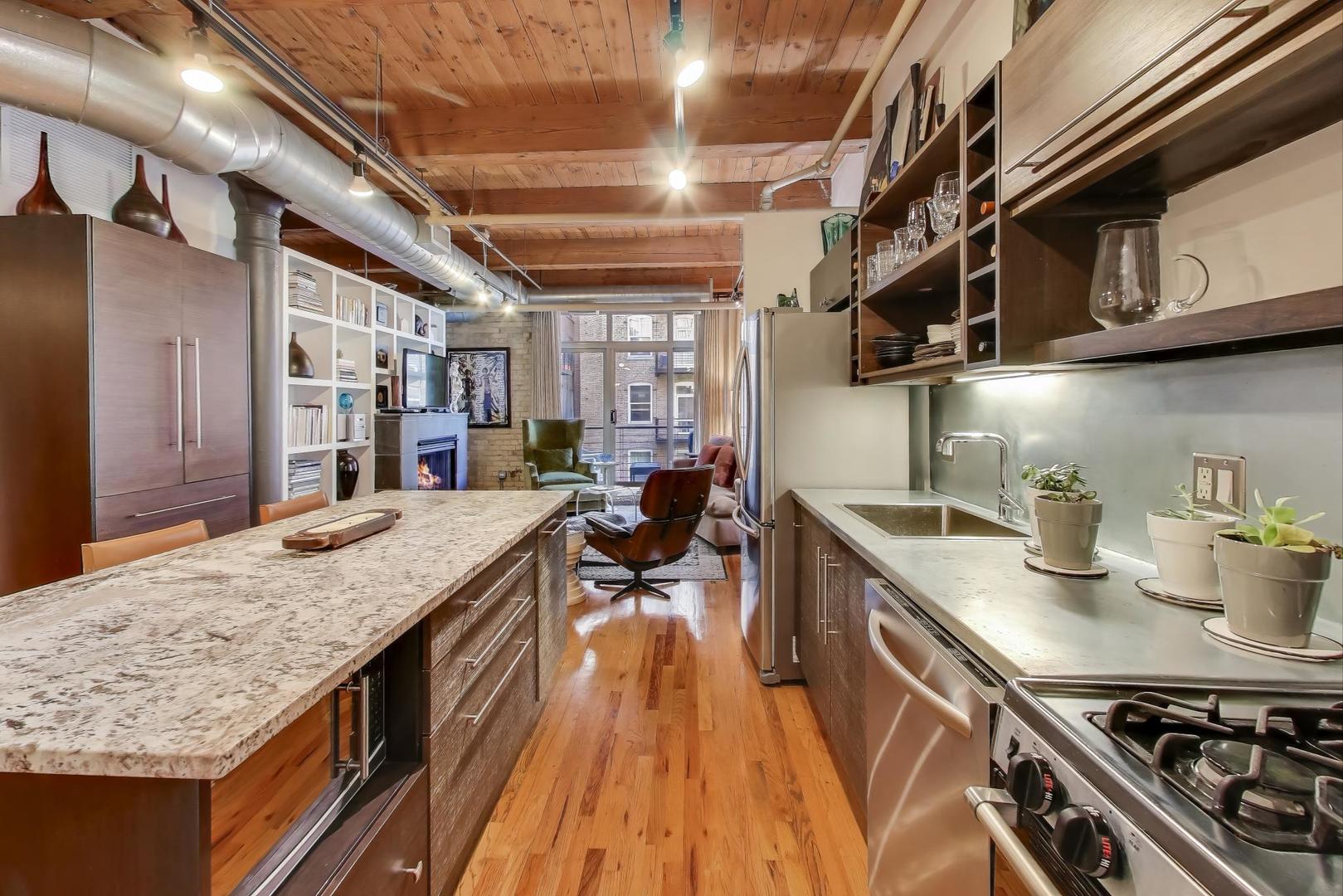 420 South Clinton Street, Unit 414A Chicago, IL 60607 - Photo 5 of 13 a kitchen with sink stove and cabinets