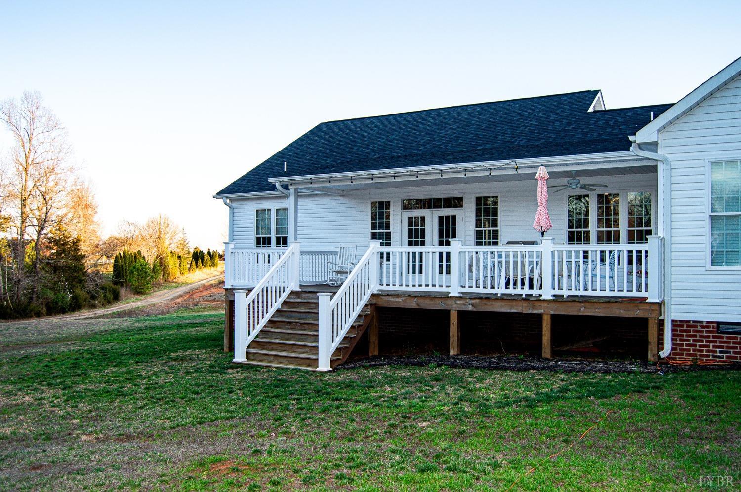 7108 Callands Road Chatham, VA 24531 - Photo 11 of 63 a view of a house with a yard and deck