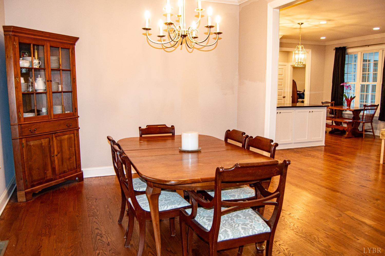 7108 Callands Road Chatham, VA 24531 - Photo 18 of 63 a view of a dining room with furniture and wooden floor
