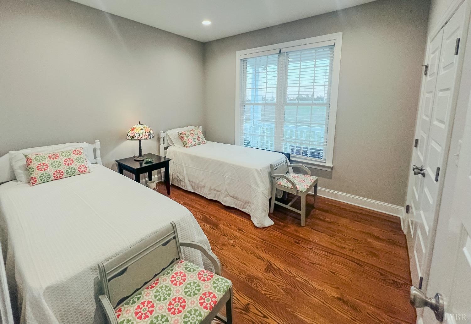 7108 Callands Road Chatham, VA 24531 - Photo 19 of 63 a bedroom with two beds and a window