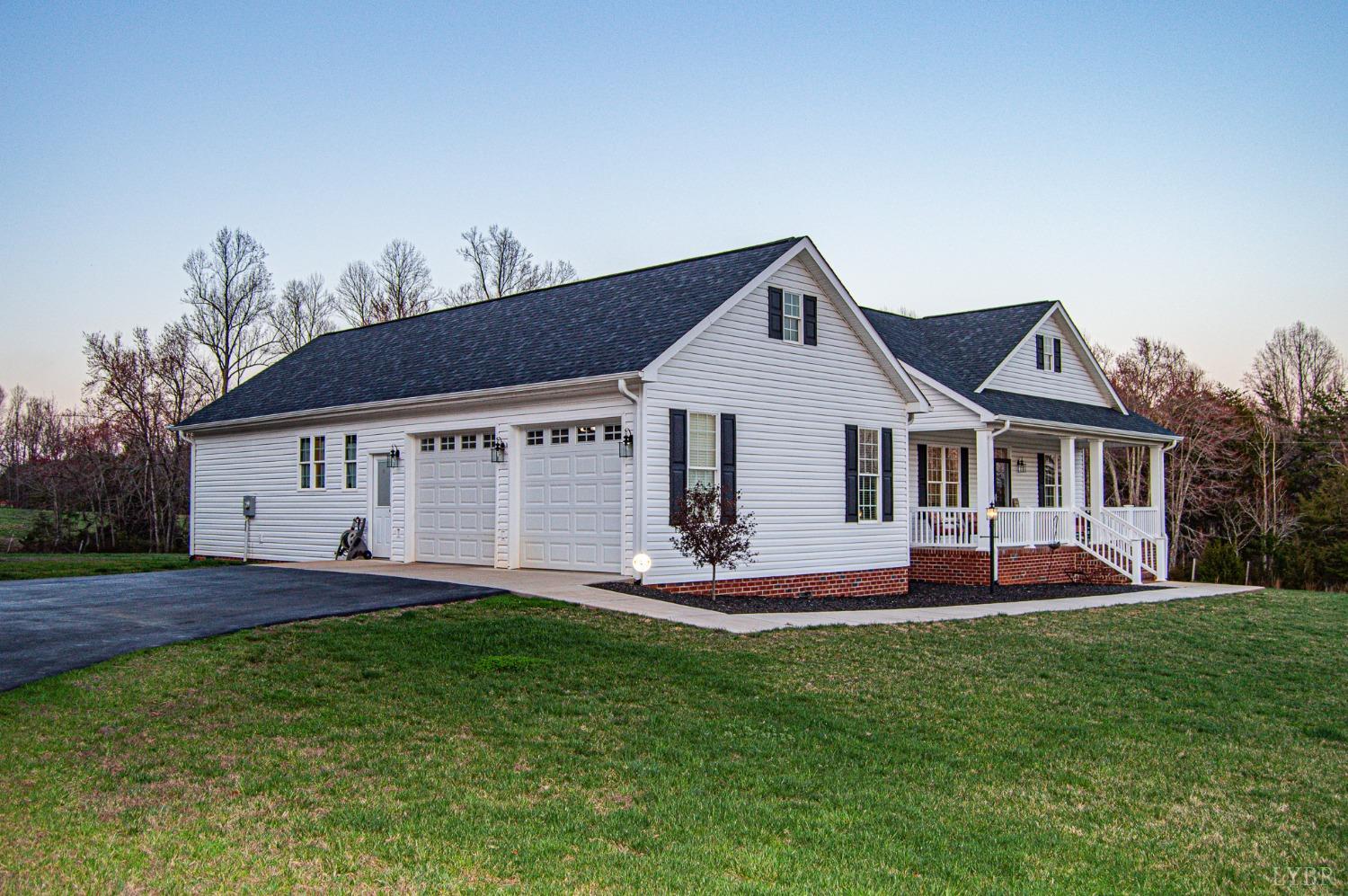 7108 Callands Road Chatham, VA 24531 - Photo 2 of 63 a front view of a house with a yard and trees