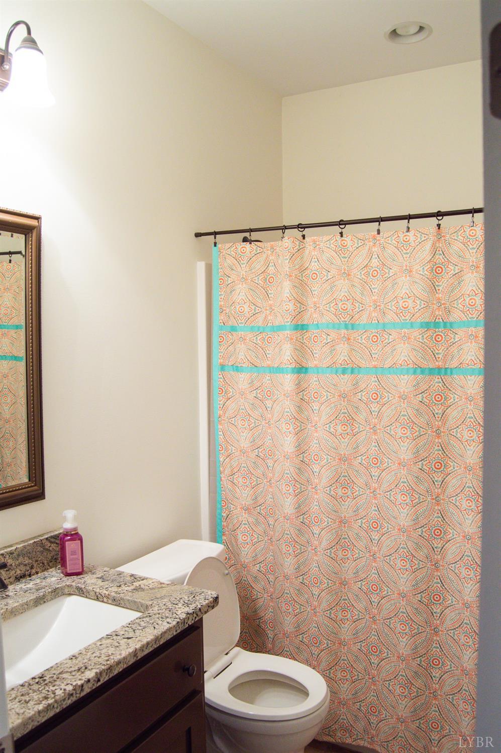 7108 Callands Road Chatham, VA 24531 - Photo 21 of 63 a bathroom with a granite countertop sink and a mirror