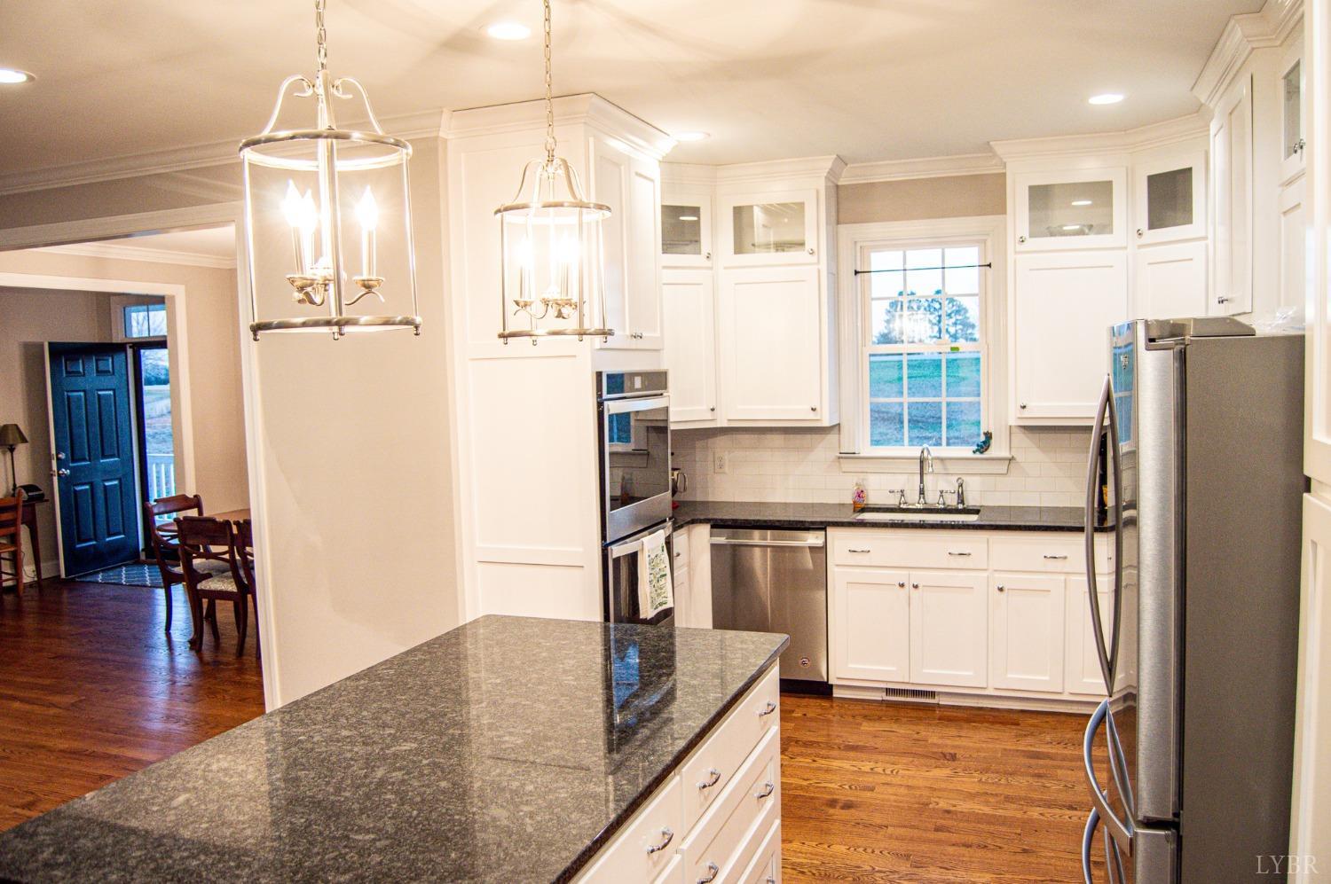 7108 Callands Road Chatham, VA 24531 - Photo 30 of 63 a kitchen with stainless steel appliances granite countertop a refrigerator and a stove top oven