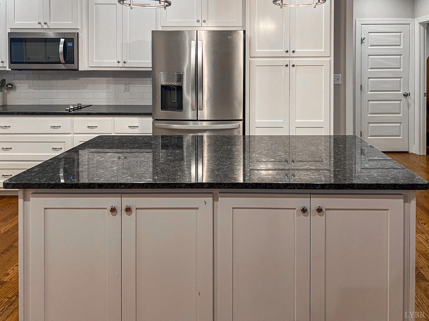 7108 Callands Road Chatham, VA 24531 - Photo 31 of 63 a kitchen with granite countertop a refrigerator and a sink