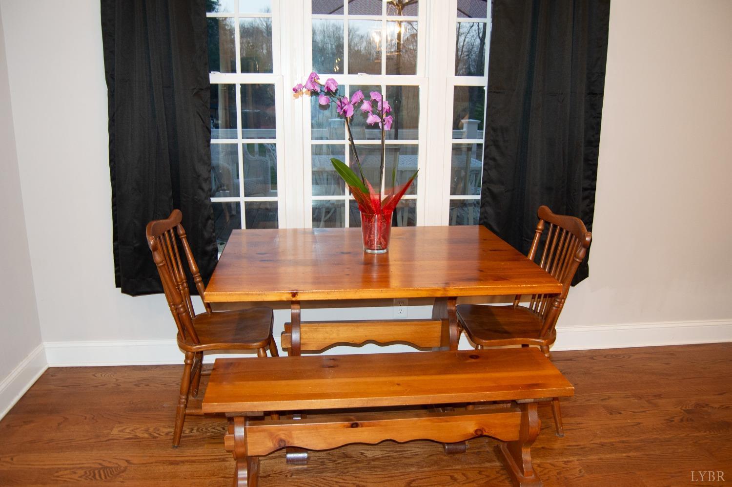 7108 Callands Road Chatham, VA 24531 - Photo 38 of 63 a view of a dining room with furniture and wooden floor