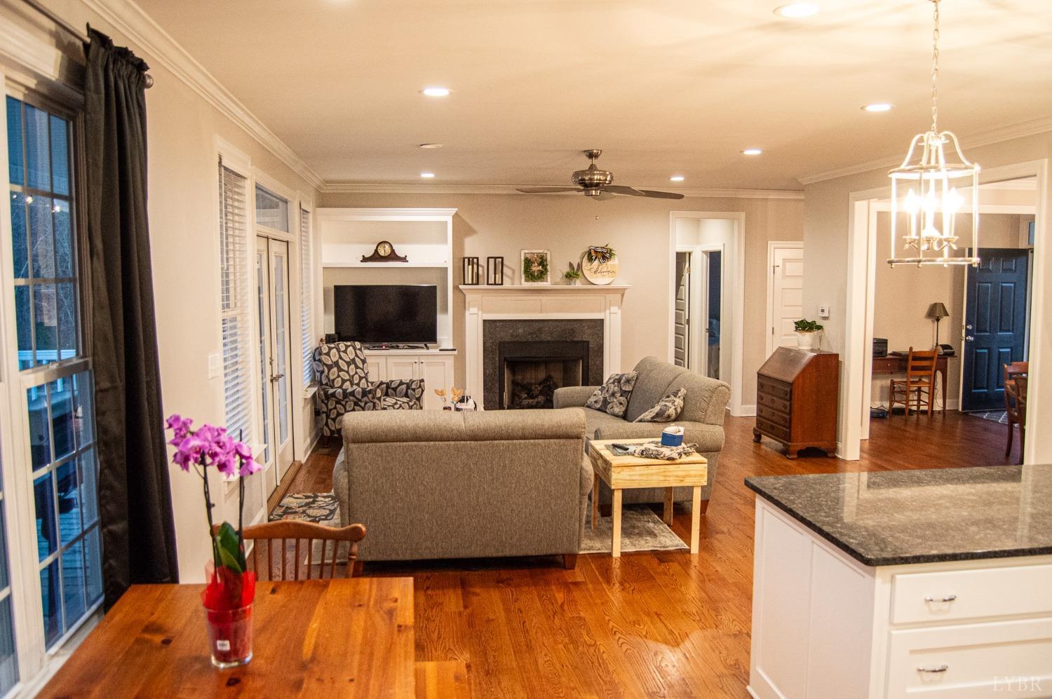 7108 Callands Road Chatham, VA 24531 - Photo 39 of 63 a living room with furniture a flat screen tv and a fireplace