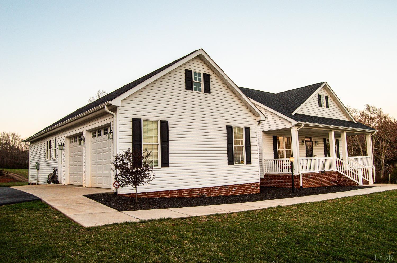 7108 Callands Road Chatham, VA 24531 - Photo 4 of 63 a front view of a house with a yard