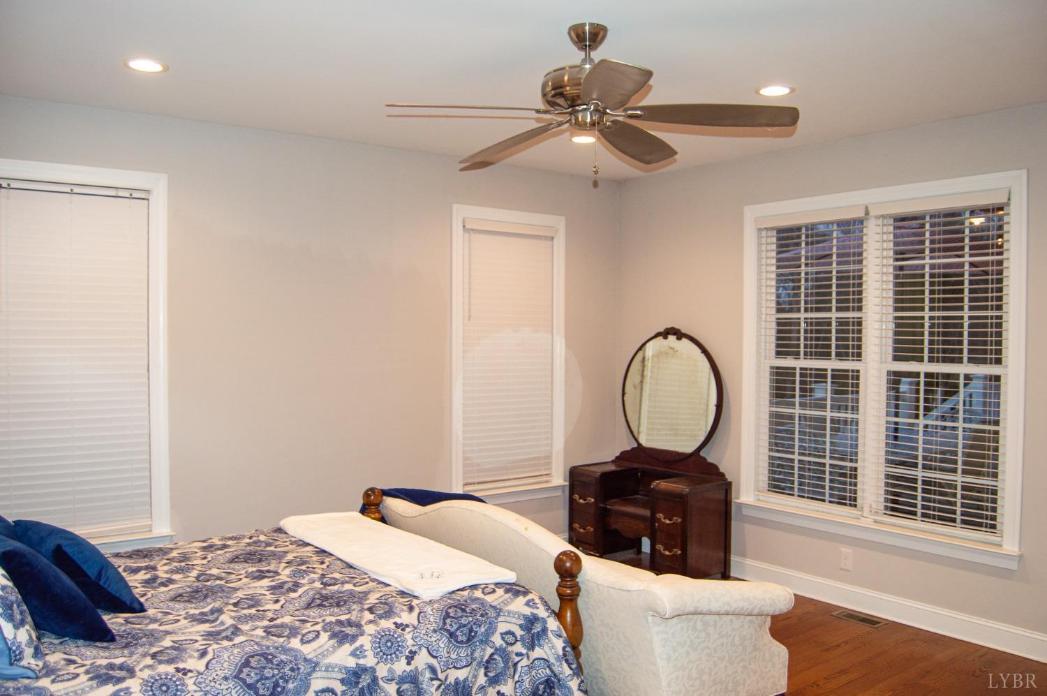 7108 Callands Road Chatham, VA 24531 - Photo 44 of 63 a bedroom with a bed and a large window