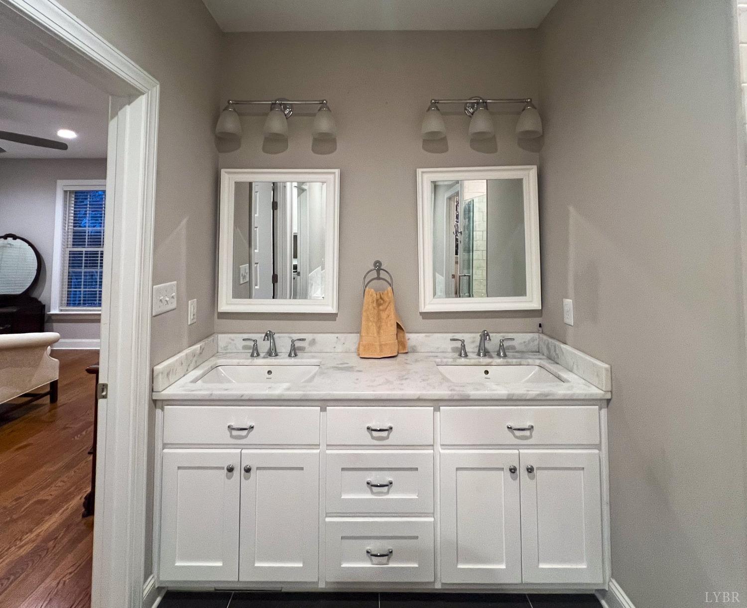 7108 Callands Road Chatham, VA 24531 - Photo 47 of 63 a bathroom with a sink vanity and mirror