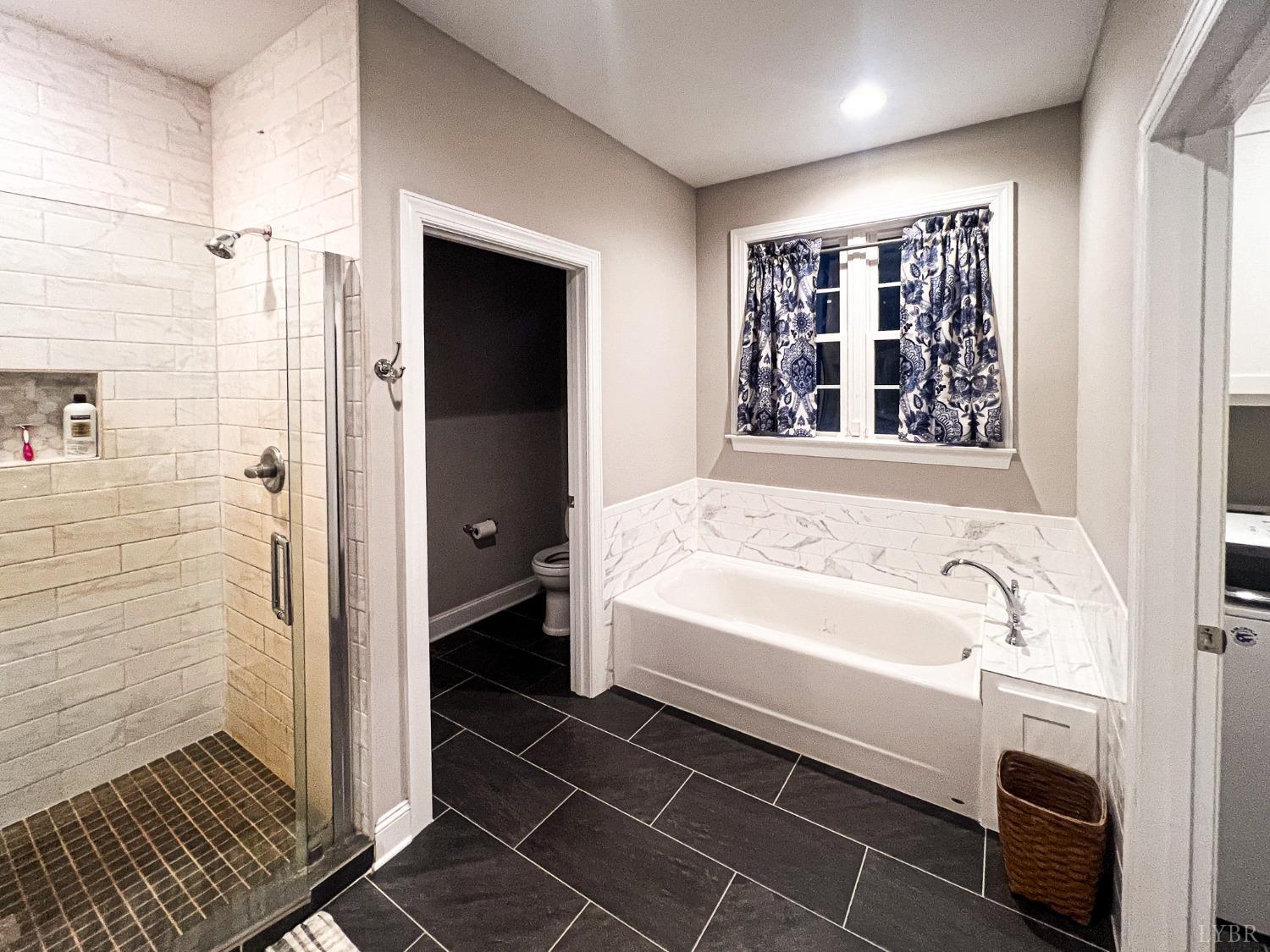 7108 Callands Road Chatham, VA 24531 - Photo 49 of 63 a bathroom with a bathtub and a shower