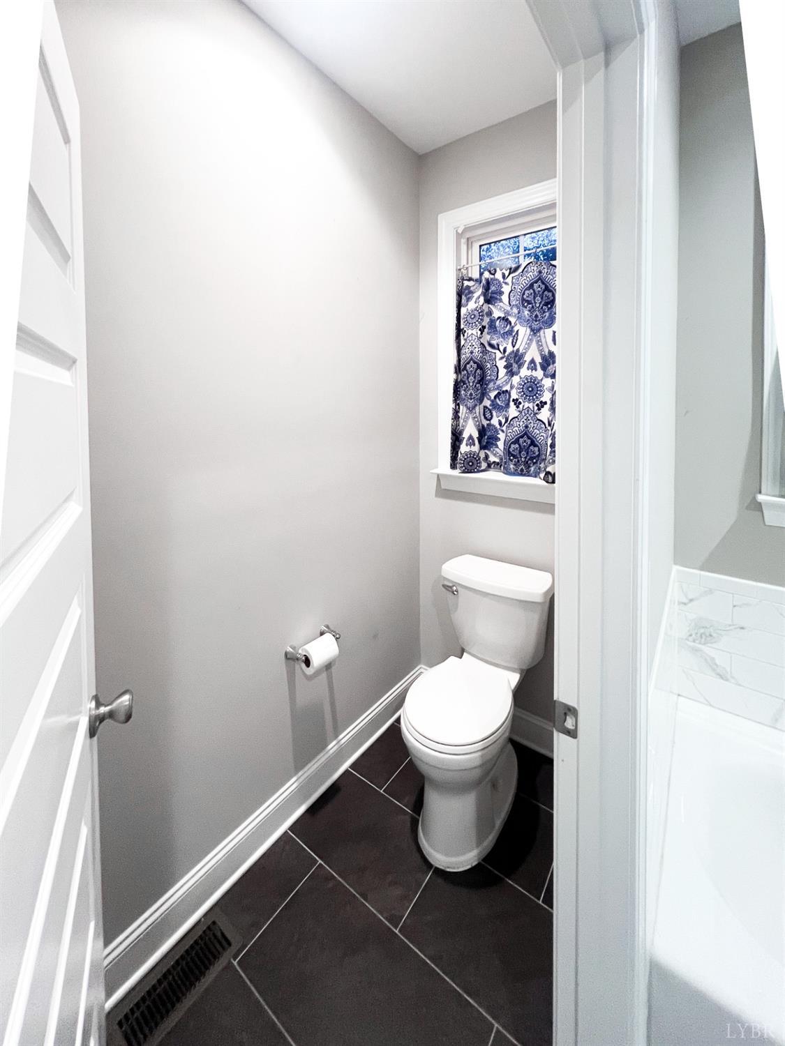 7108 Callands Road Chatham, VA 24531 - Photo 50 of 63 a bathroom with a toilet and a shower