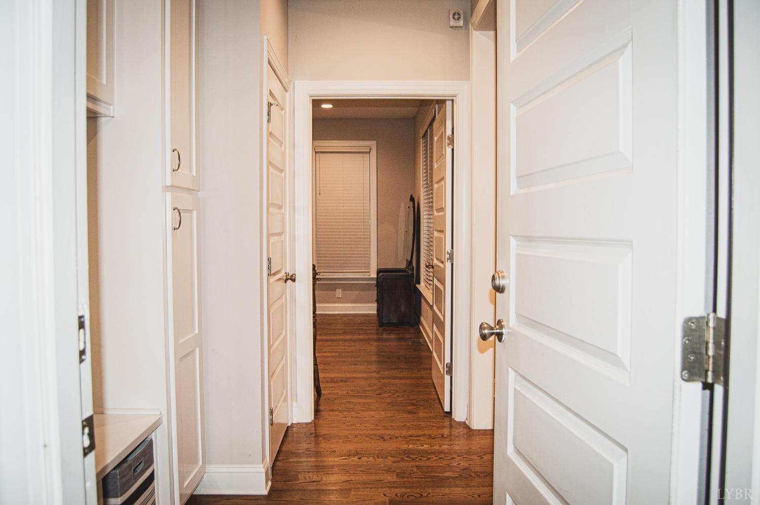 7108 Callands Road Chatham, VA 24531 - Photo 59 of 63 a view of a hallway with wooden floor and staircase