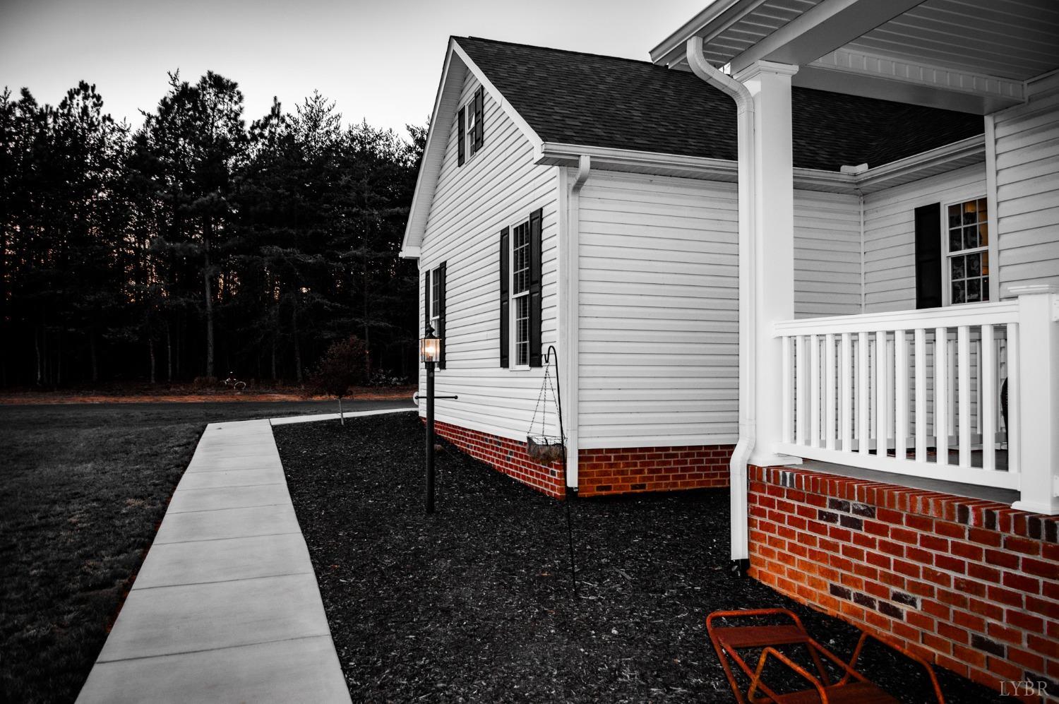 7108 Callands Road Chatham, VA 24531 - Photo 8 of 63 a view of a house with backyard and deck