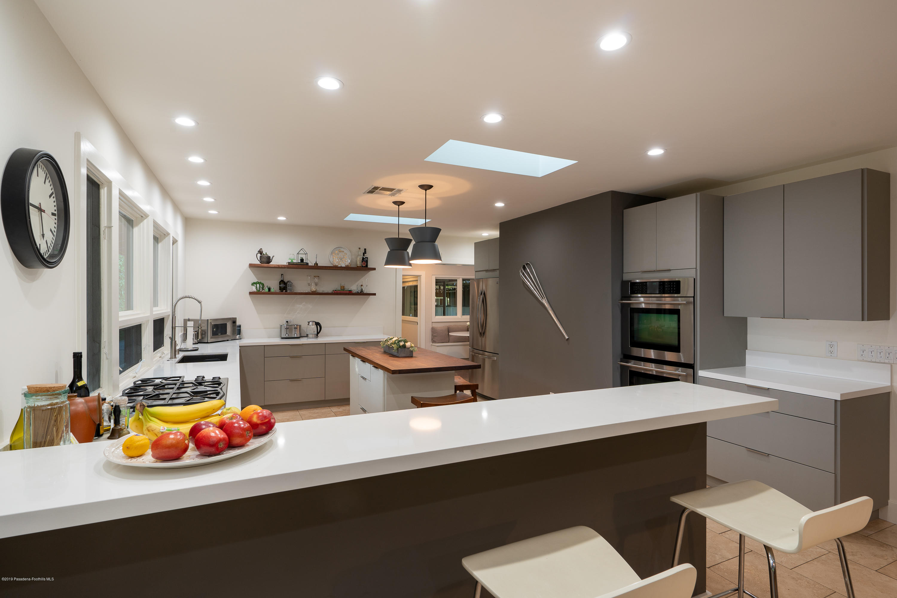 3795 Shadow Grove Road Pasadena, CA 91107 - Photo 16 of 48 a kitchen with stainless steel appliances a sink and a refrigerator