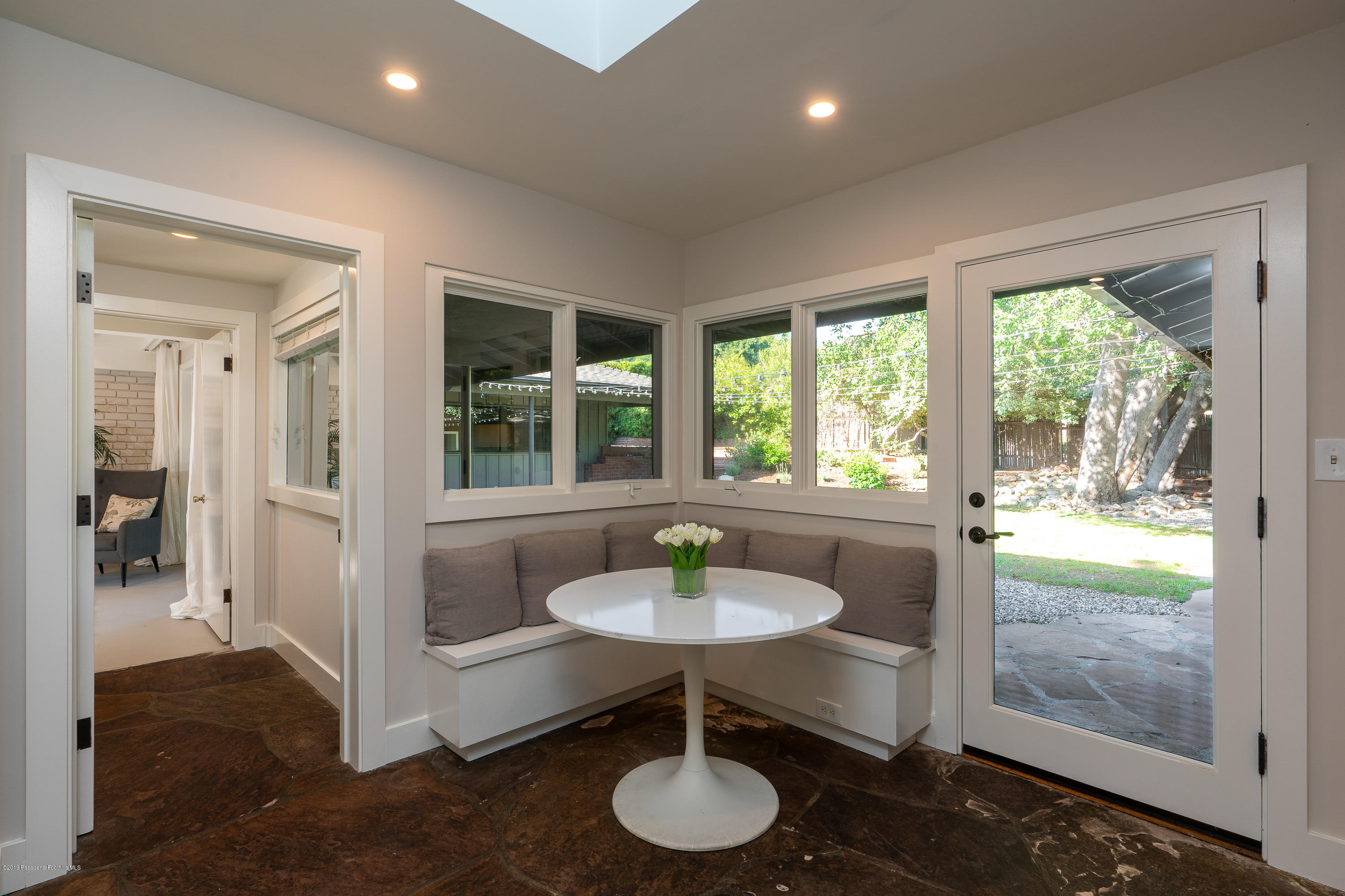 3795 Shadow Grove Road Pasadena, CA 91107 - Photo 18 of 48 a dining room with furniture and a chandelier