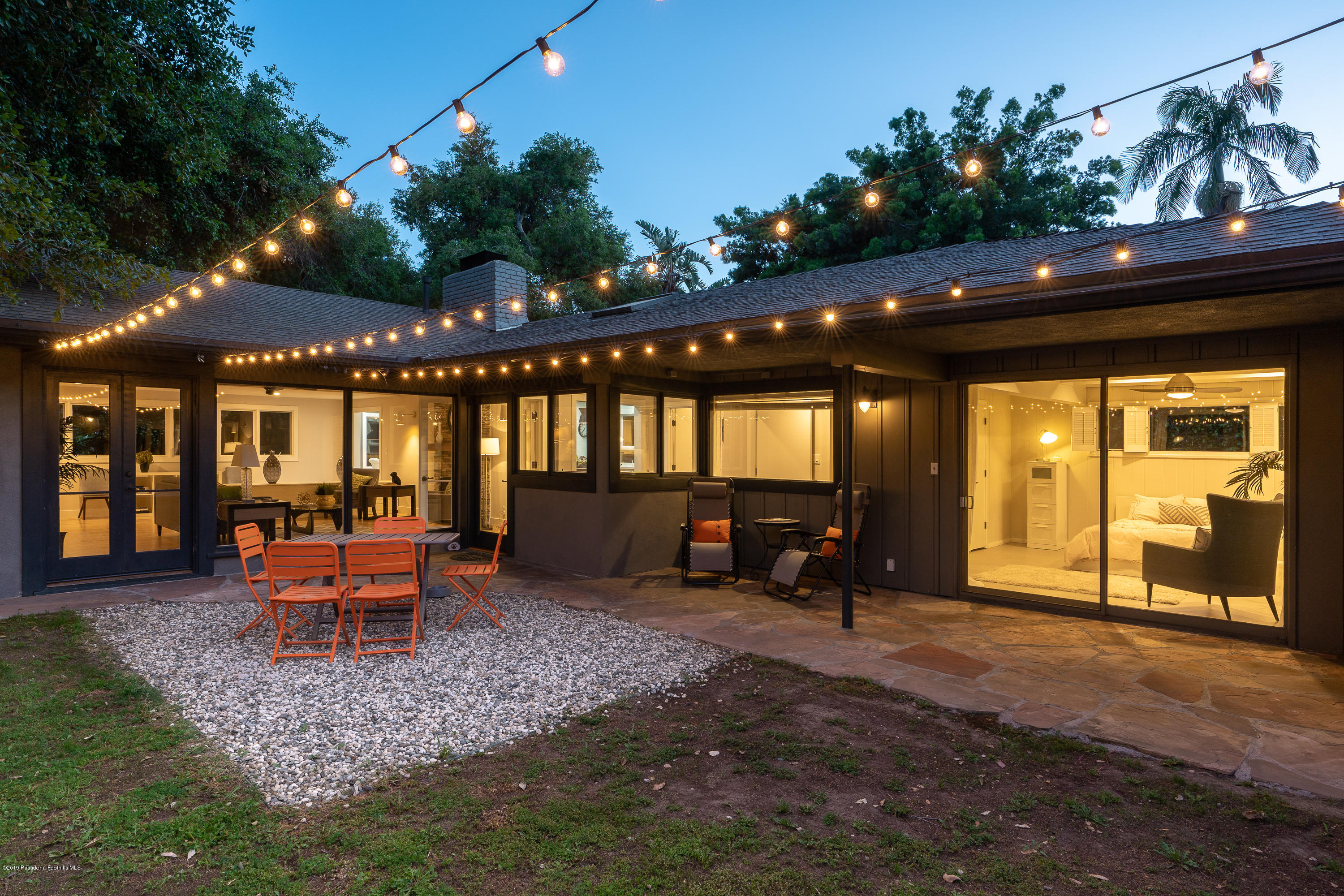3795 Shadow Grove Road Pasadena, CA 91107 - Photo 2 of 48 a view of a patio with table and chairs potted plants and floor to ceiling window
