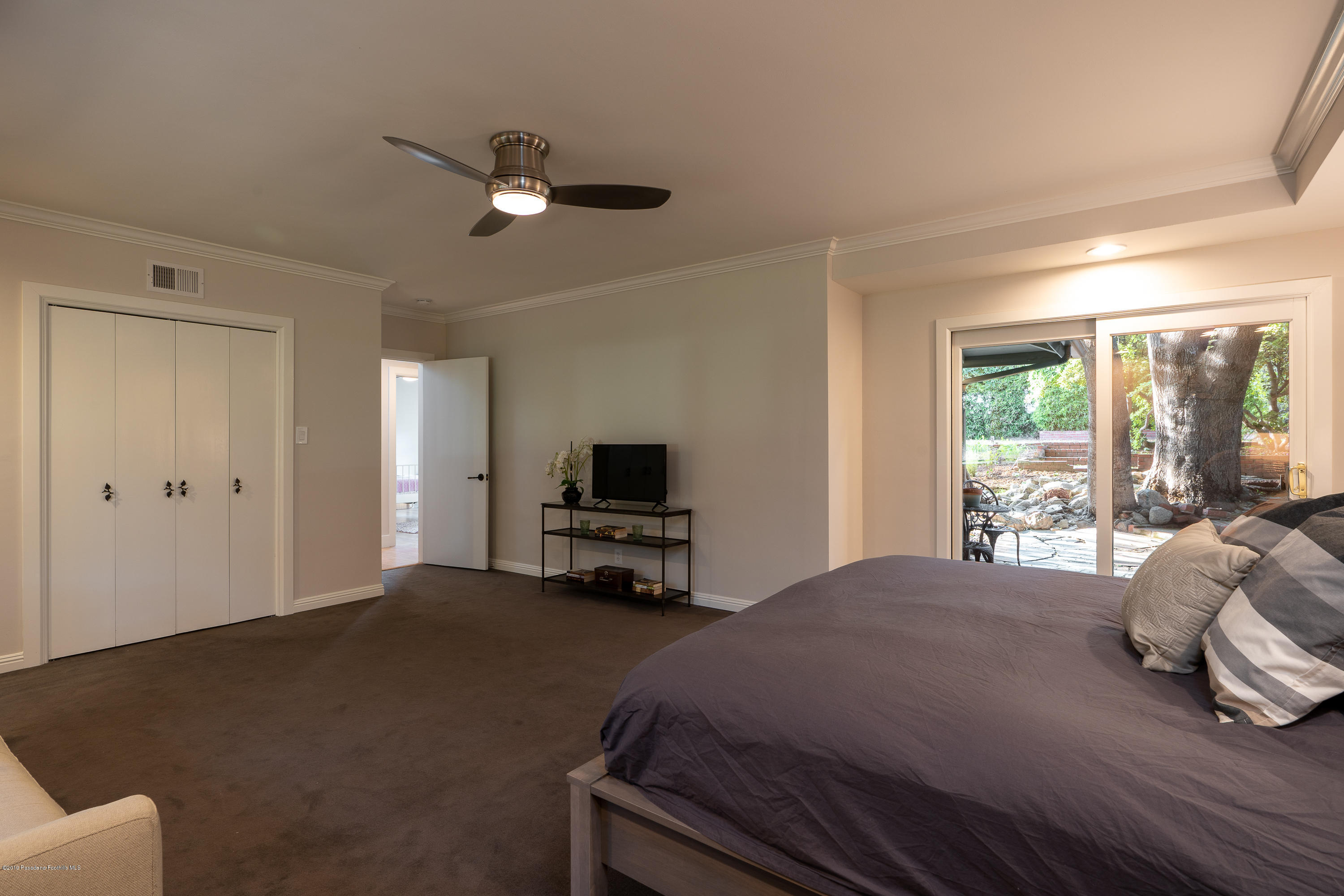 3795 Shadow Grove Road Pasadena, CA 91107 - Photo 24 of 48 a bedroom with a bed and large windows