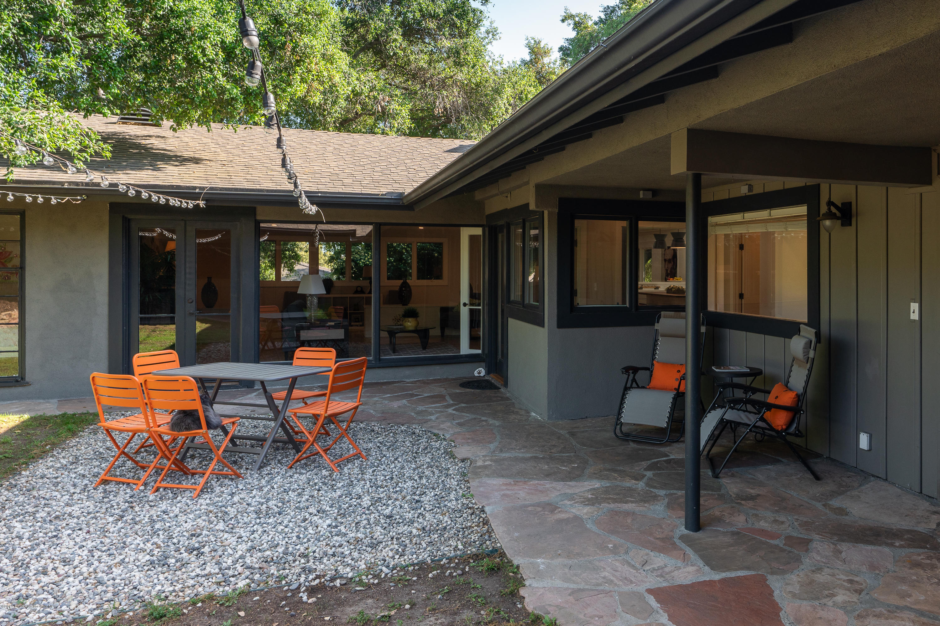 3795 Shadow Grove Road Pasadena, CA 91107 - Photo 31 of 48 an outdoor sitting area with chairs and table of the patio