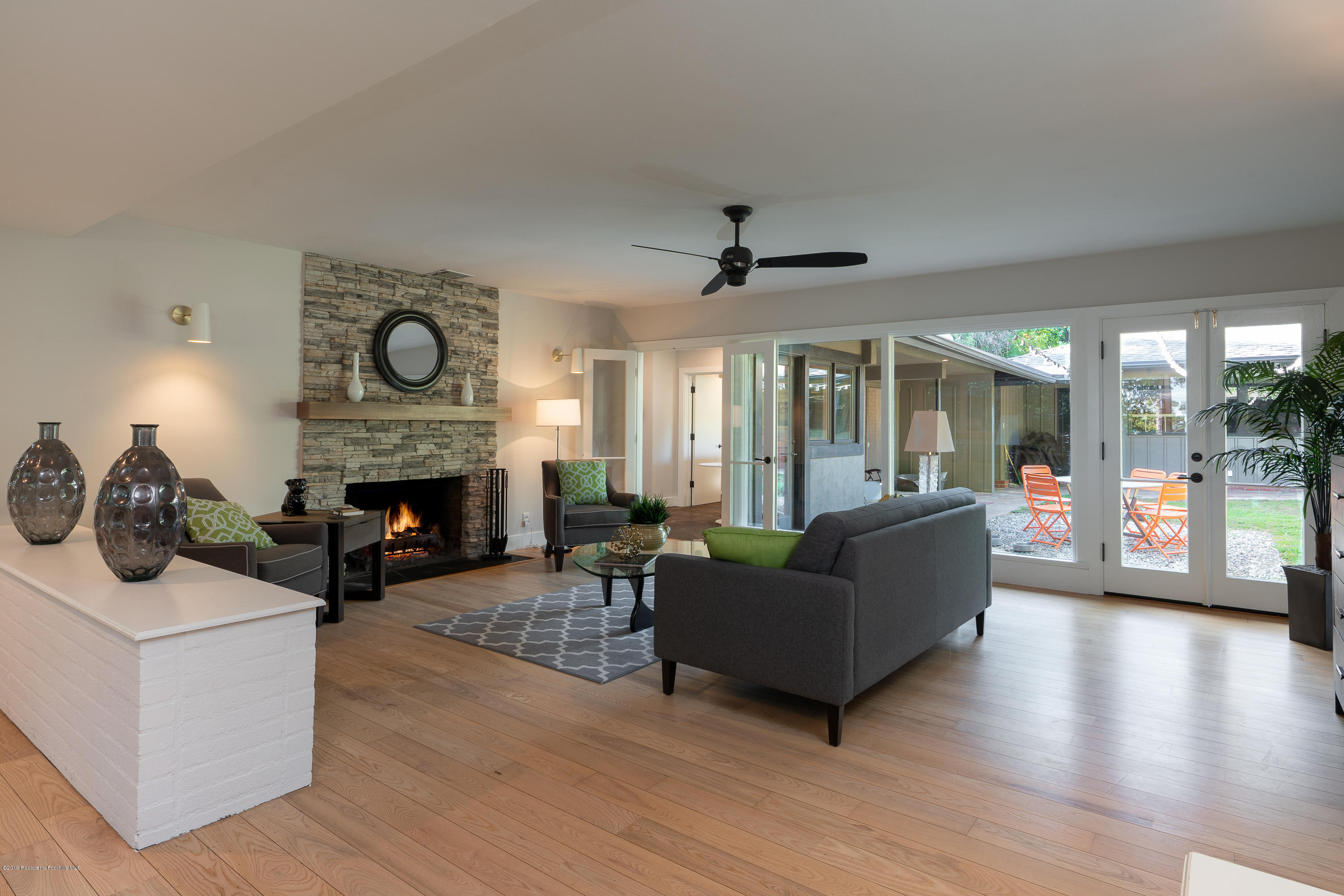 3795 Shadow Grove Road Pasadena, CA 91107 - Photo 8 of 48 a living room with furniture and a fireplace