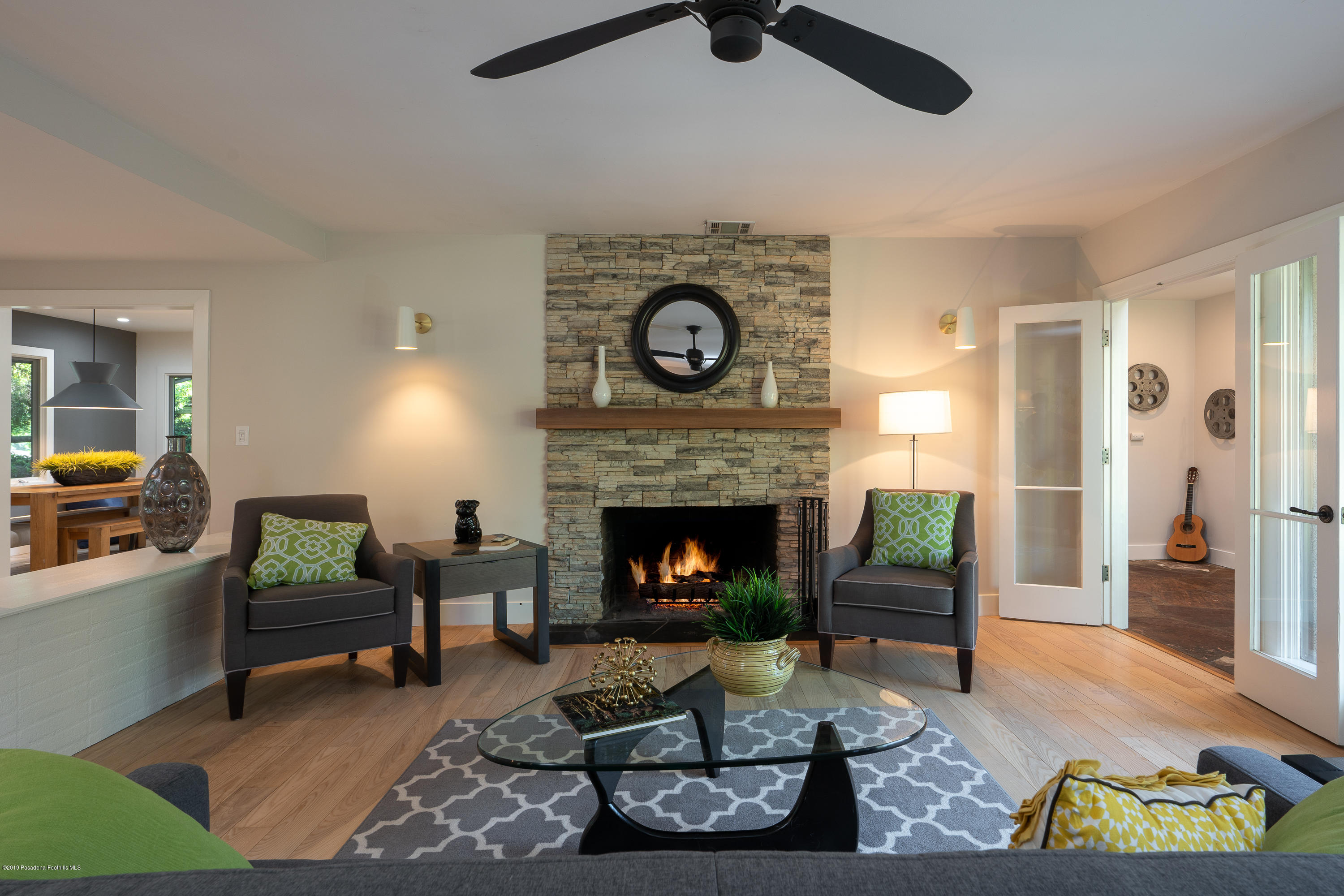 3795 Shadow Grove Road Pasadena, CA 91107 - Photo 9 of 48 a living room with furniture and a fireplace
