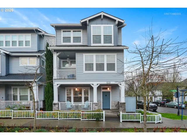 a front view of residential houses with yard